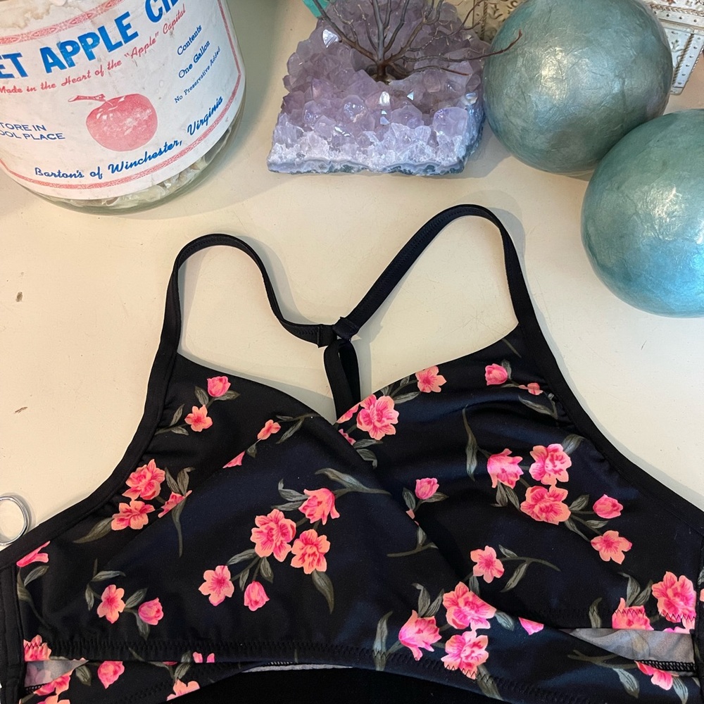 Pink sports bra crosses in front